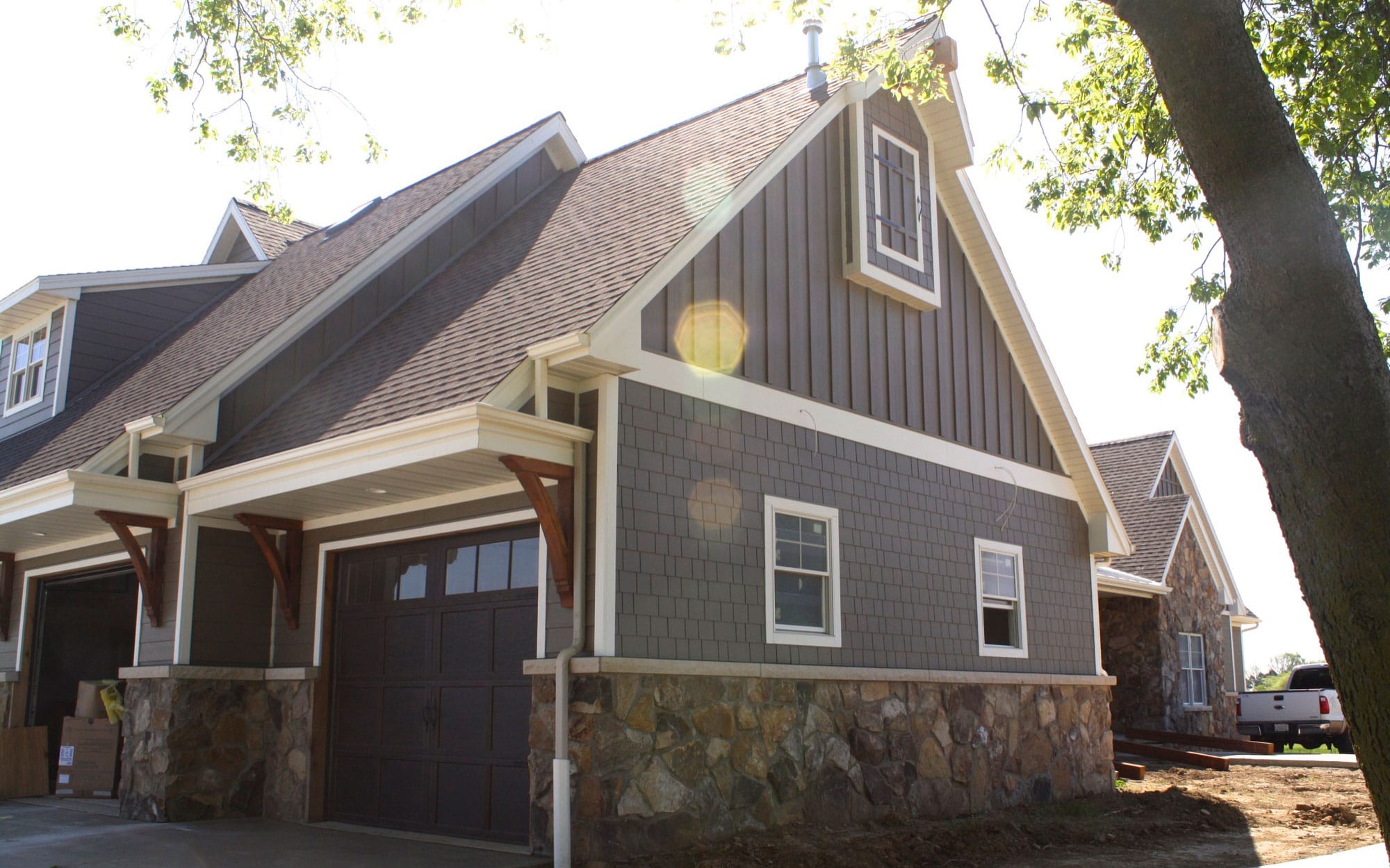 Colorado house with gray exterior, siding and roofing by WestPro